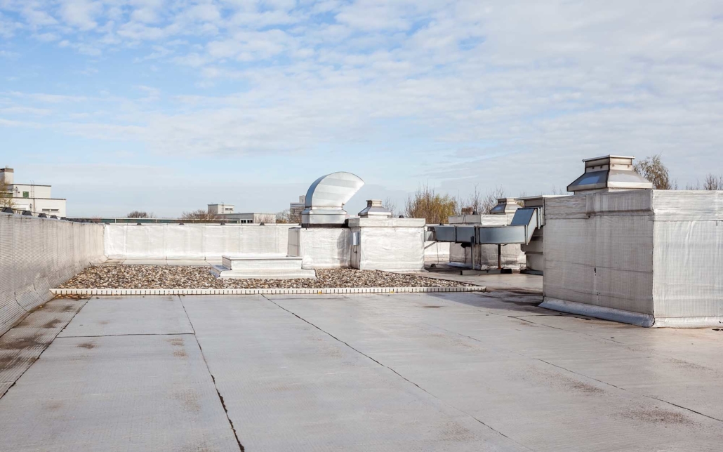 Side view on top of a grey commercial rooftop